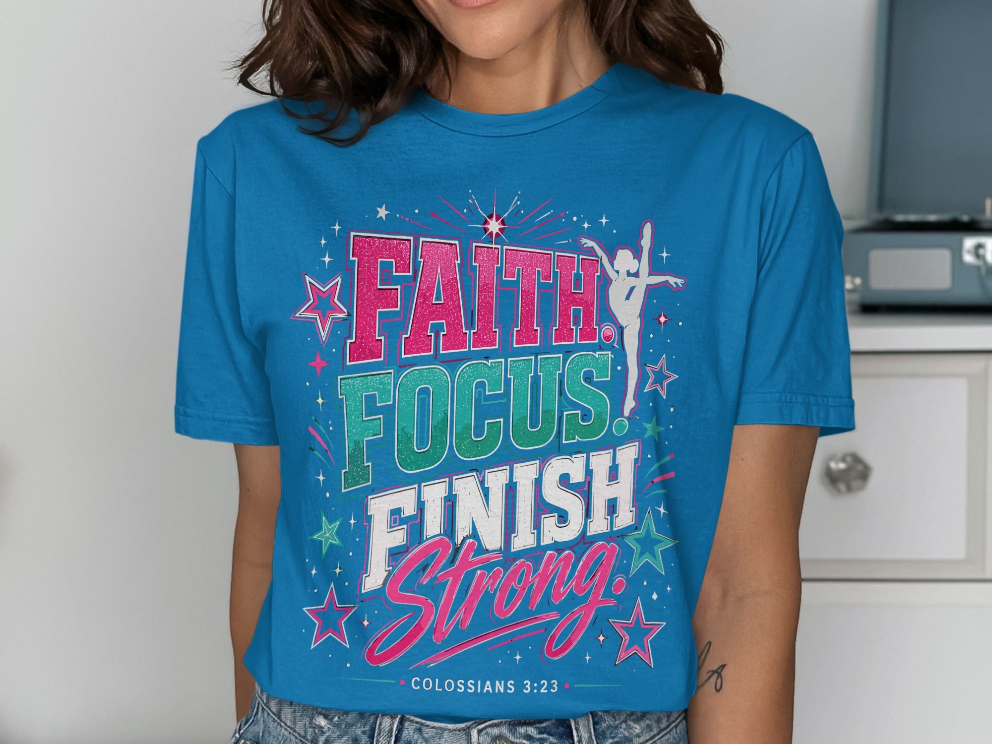 Teal t-shirt with "FAITH FOCUS FINISH STRONG" text and gymnast graphic.