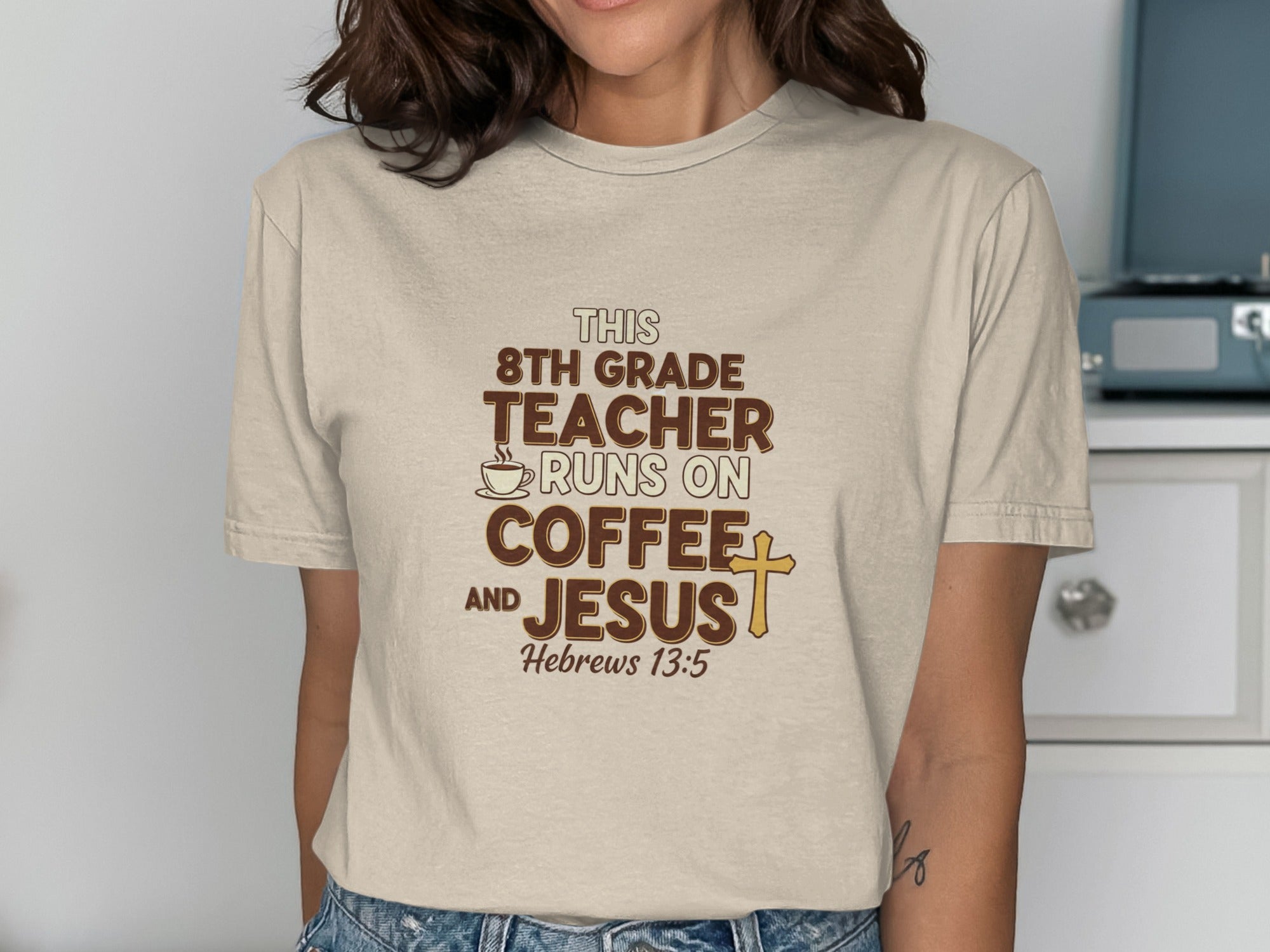 Beige t-shirt with "8th grade teacher runs on coffee and Jesus" text.