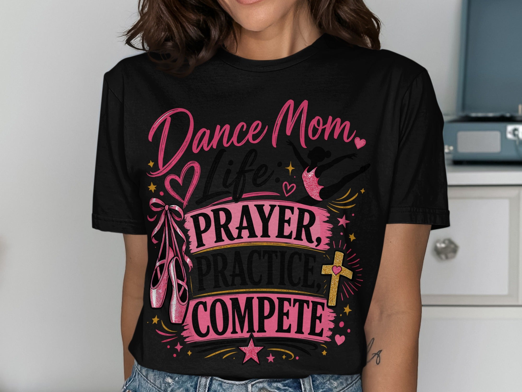 Black t-shirt with "Dance Mom Life Prayer Practice Compete" text and ballet slippers.