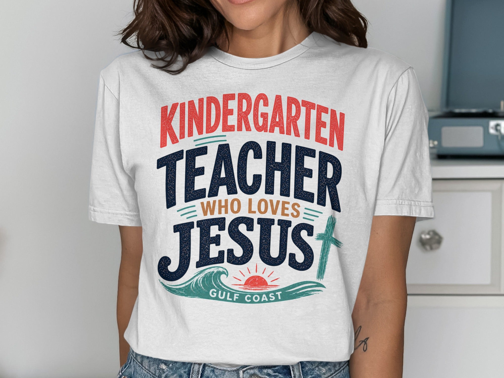 Kindergarten teacher who loves Jesus, Gulf Coast graphic on a white t-shirt.