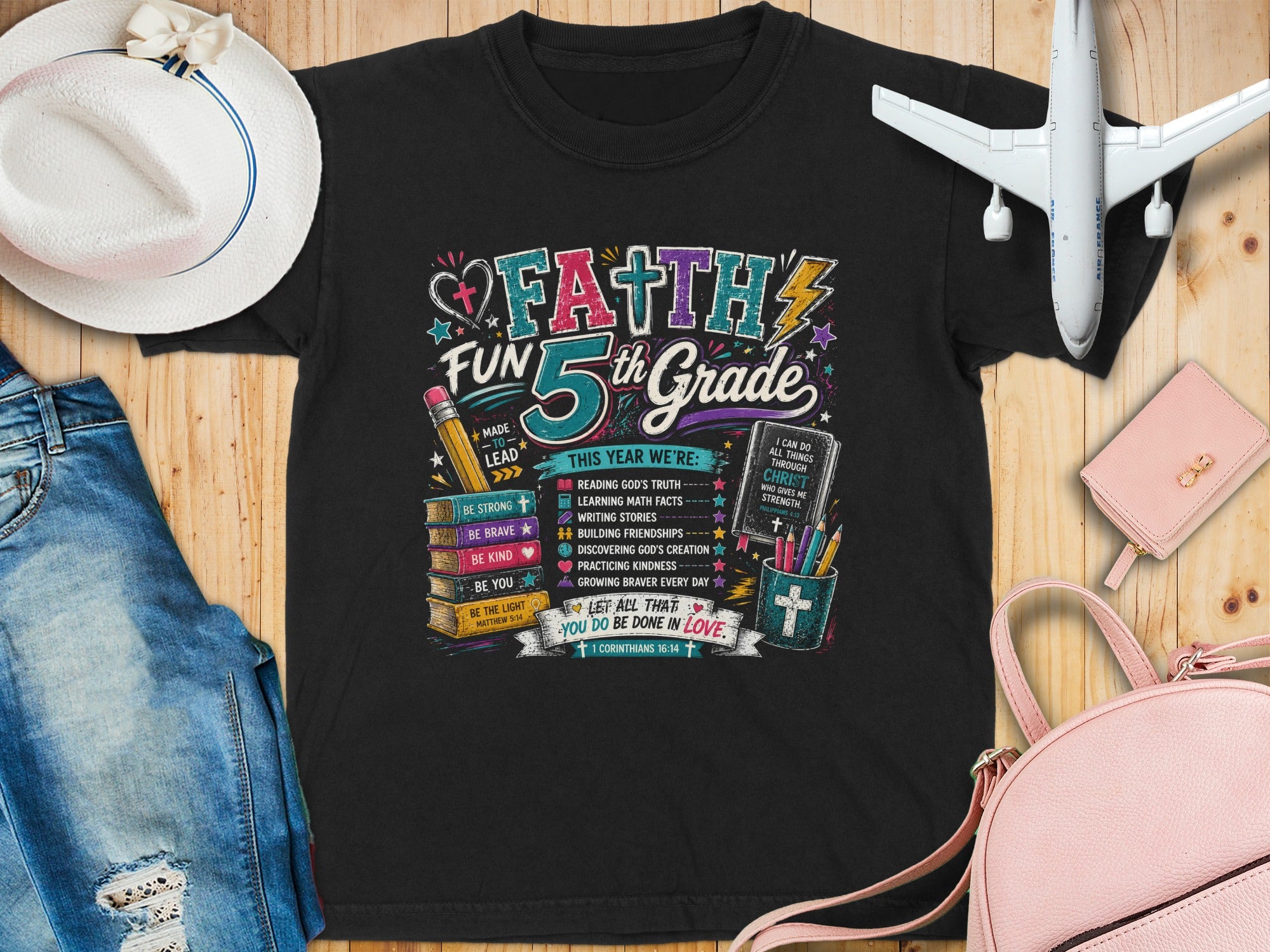 "Faith 5th Grade" graphic t-shirt with biblical verses and uplifting messages.