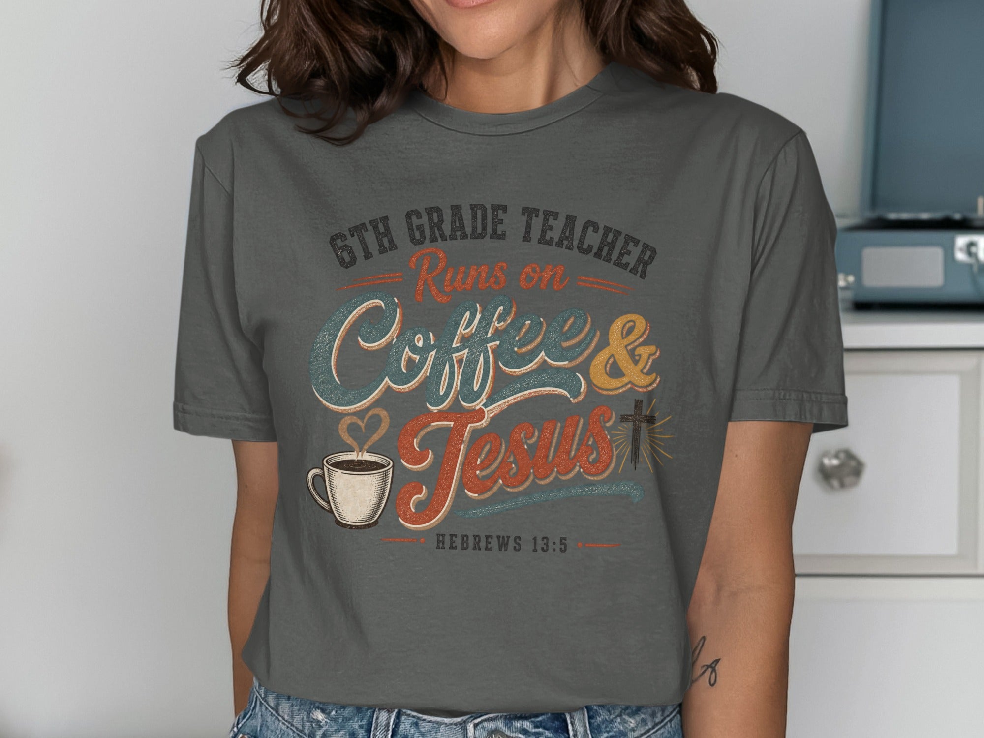 Dark gray t-shirt with "6th Grade Teacher Runs on Coffee & Jesus" text.