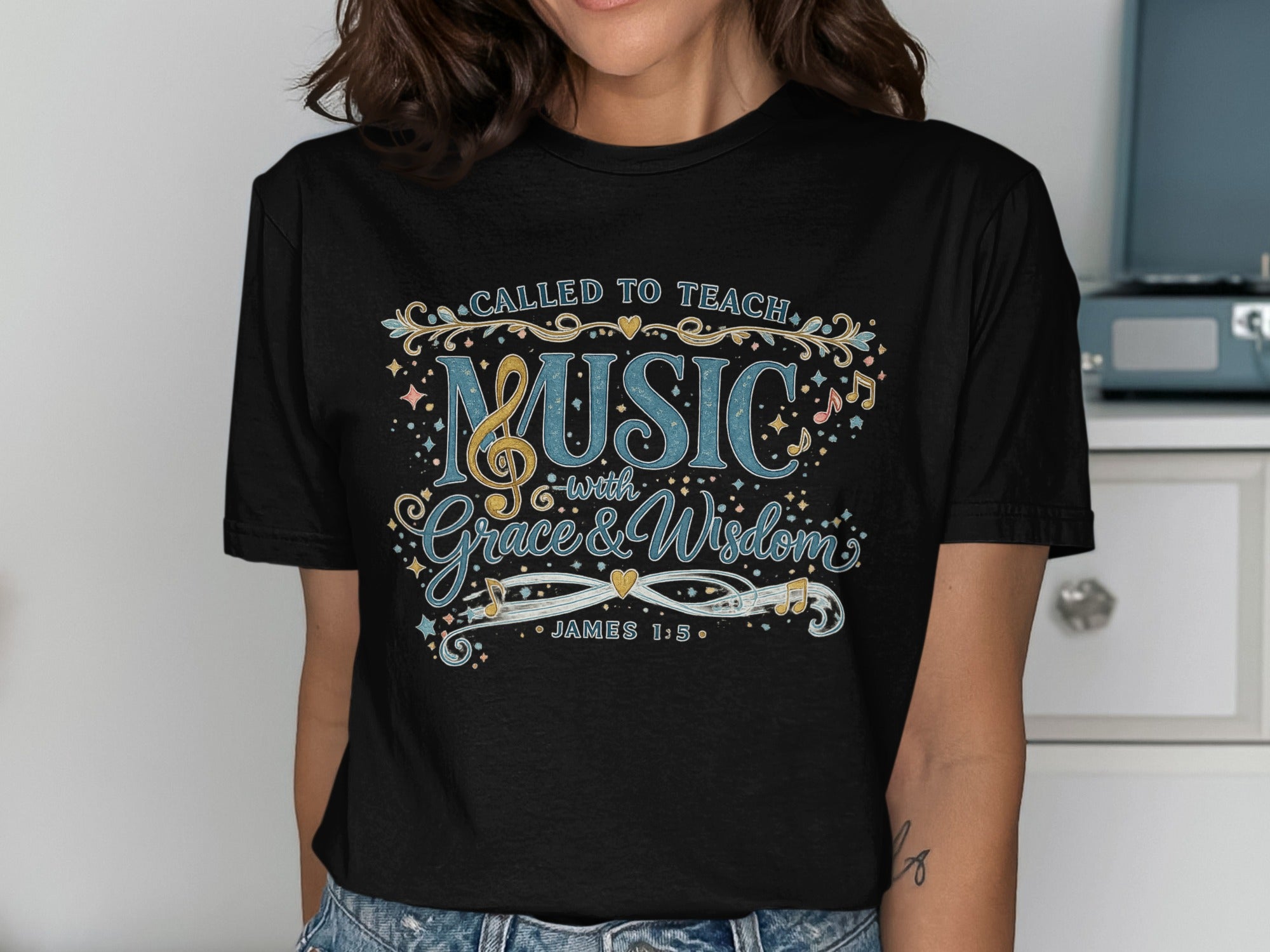 Black t-shirt with "Called to Teach Music with Grace & Wisdom" and Bible verse.