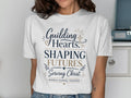 T-shirt with "Guiding Hearts, Shaping Futures, Serving Christ, Middle School Teacher" text.