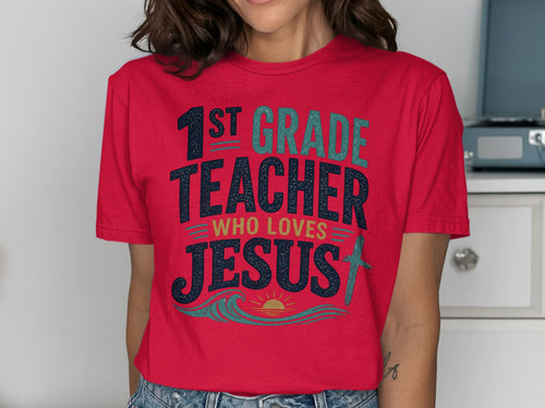 Red t-shirt with "1st Grade Teacher Who Loves Jesus" text and wavy design.
