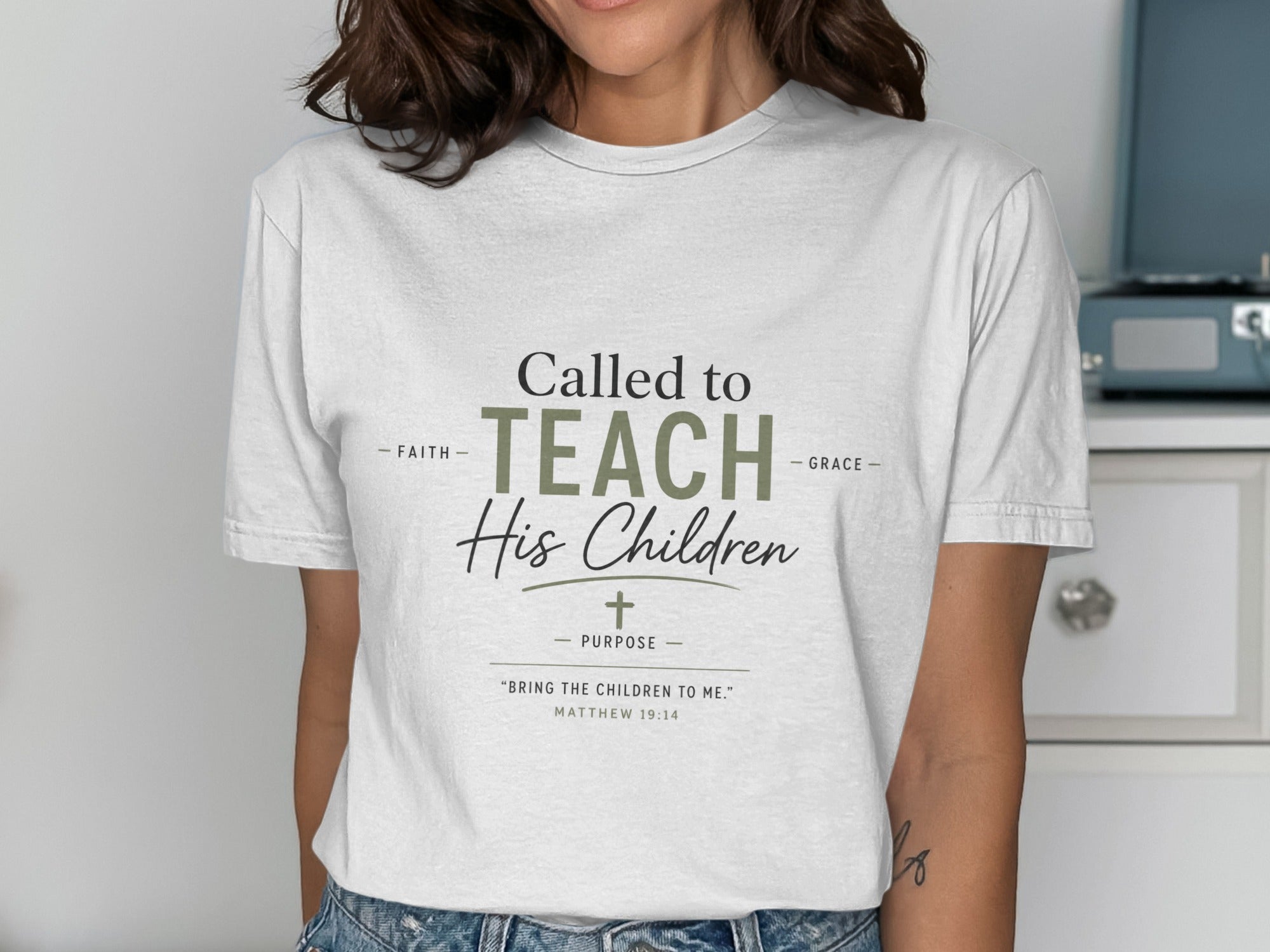 White t-shirt with text "Called to TEACH His Children" and Matthew 19:14 Bible verse.