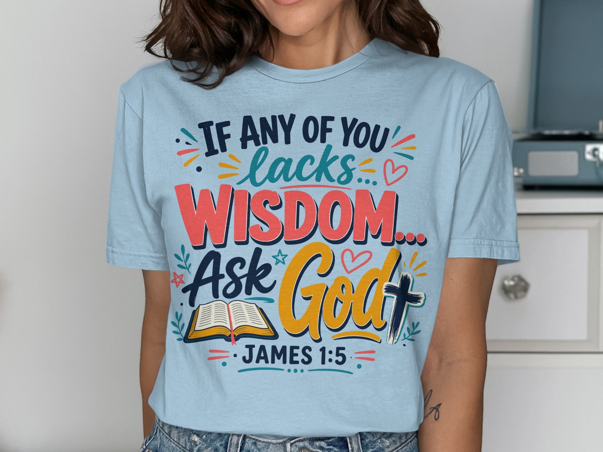 Light blue t-shirt with "If any of you lacks wisdom... Ask God" text and Bible graphic.