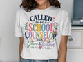 White t-shirt with colorful text "Called to be a School Counselor with Grace & Wisdom".