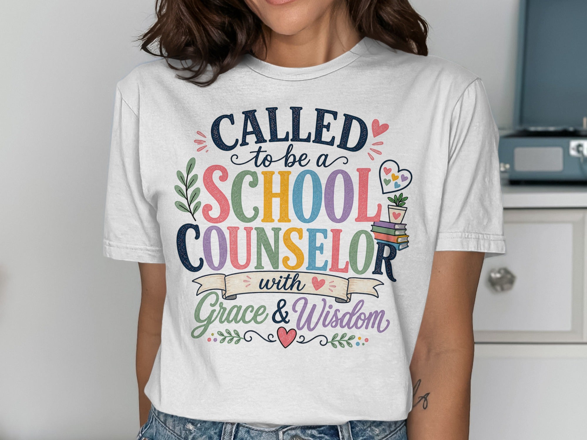 White t-shirt with colorful text "Called to be a School Counselor with Grace & Wisdom".