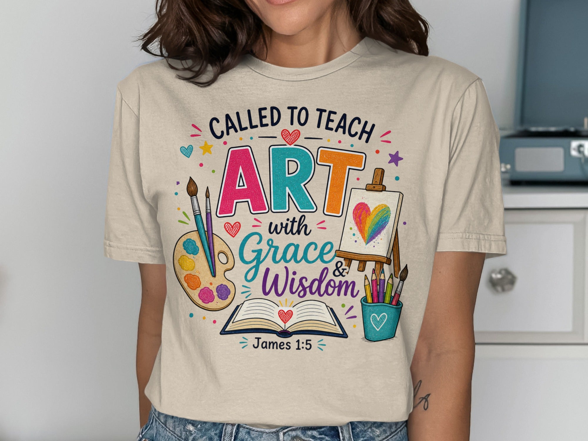 T-shirt with "Called to Teach with ART Grace Wisdom" and Bible verse James 1:5.