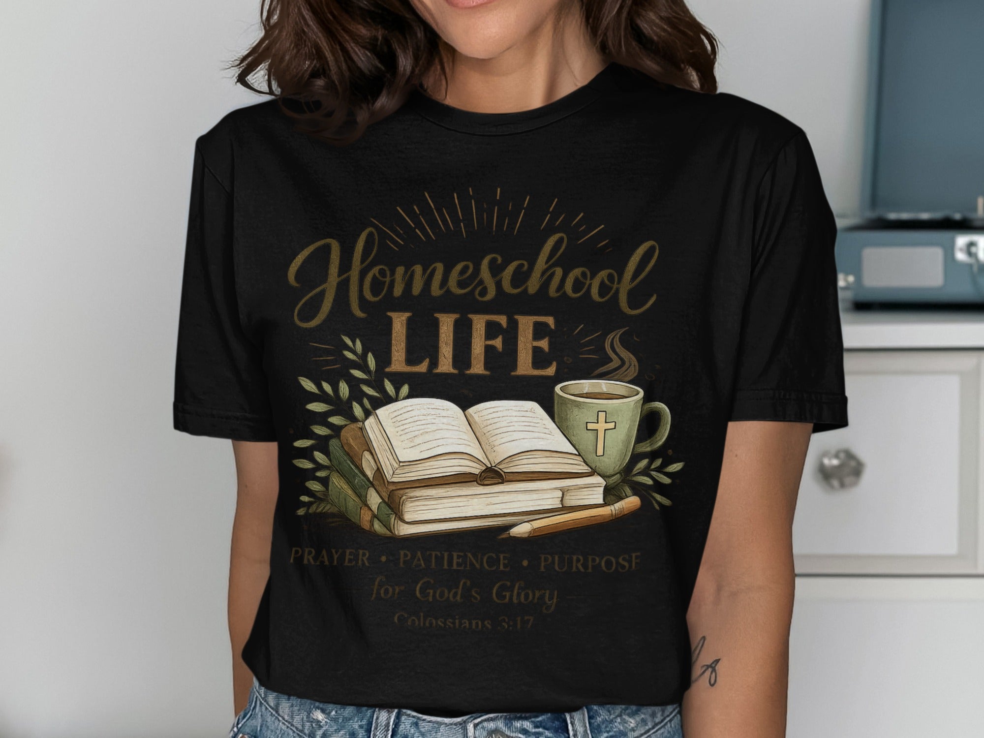 Black t-shirt with "Homeschool LIFE" text, open book, and coffee mug.