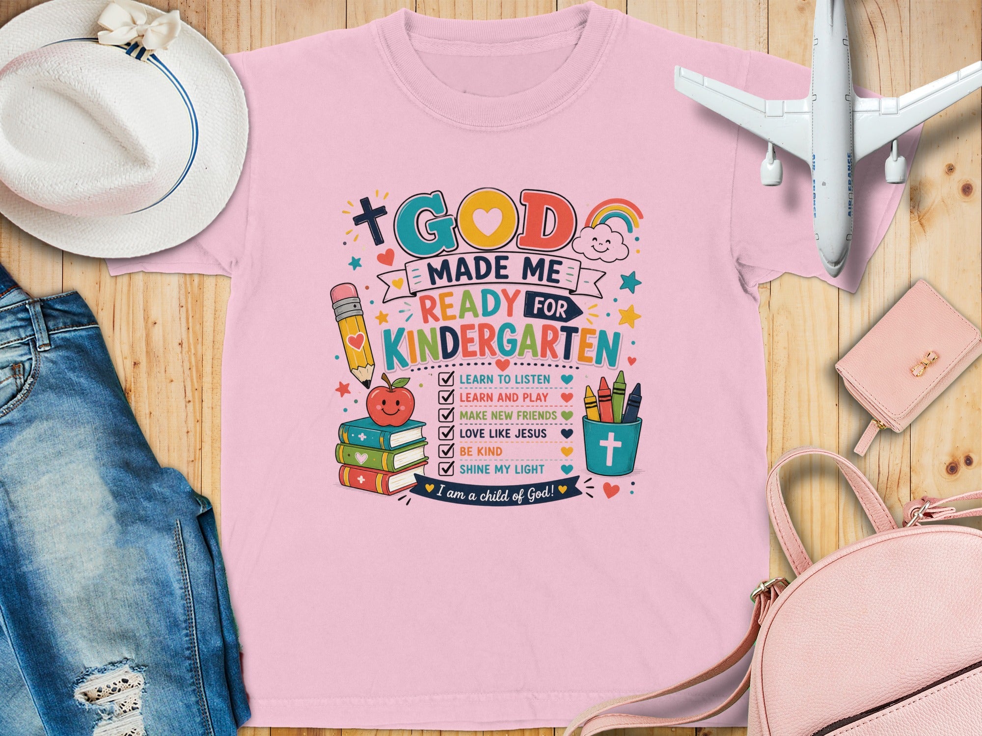 Pink t-shirt with "God made me ready for kindergarten" and a list of affirmations.
