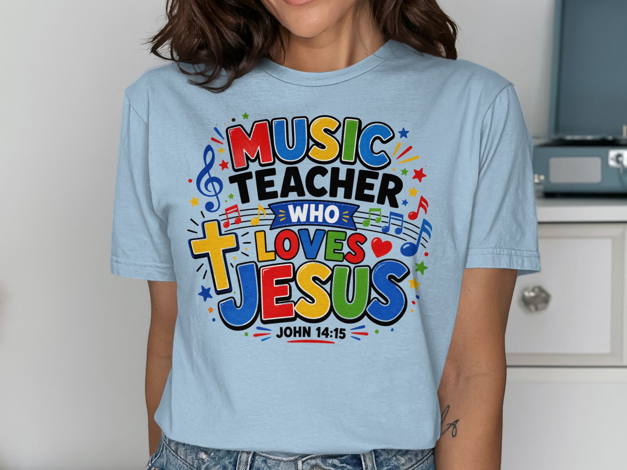 Light blue t-shirt with "MUSIC TEACHER WHO LOVES JESUS" and John 14:15.