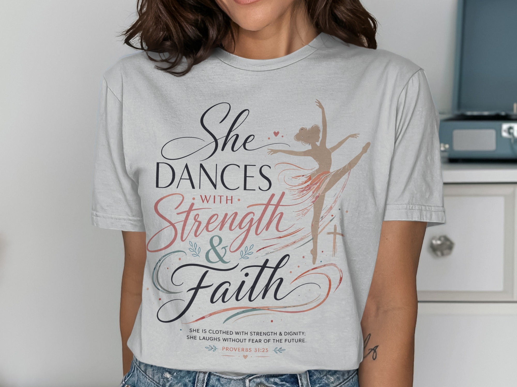 T-shirt with dancer graphic and Proverbs 31:25 text.