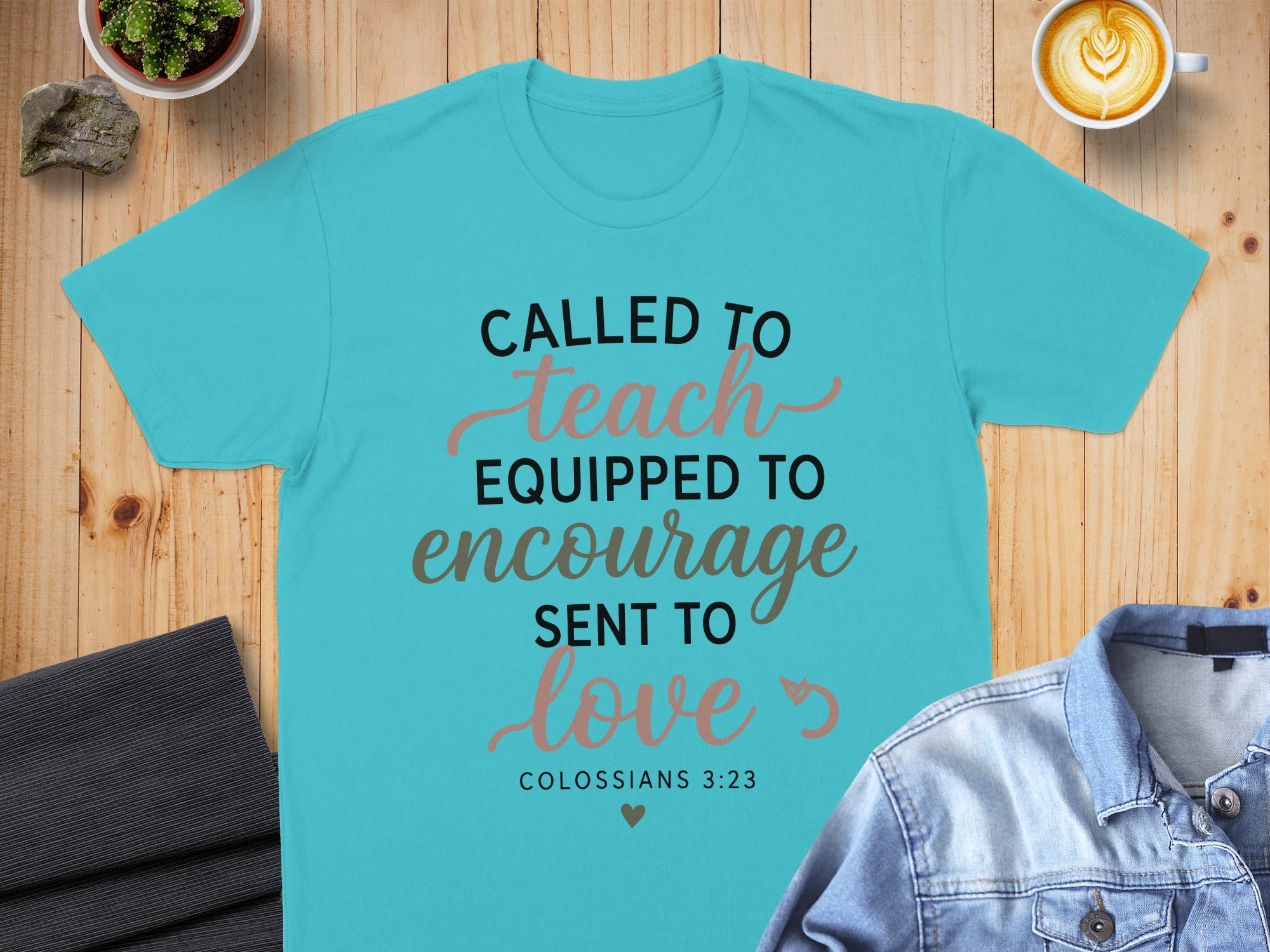 Teal t-shirt with "Called to Teach, Equipped to Encourage, Sent to Love" text.