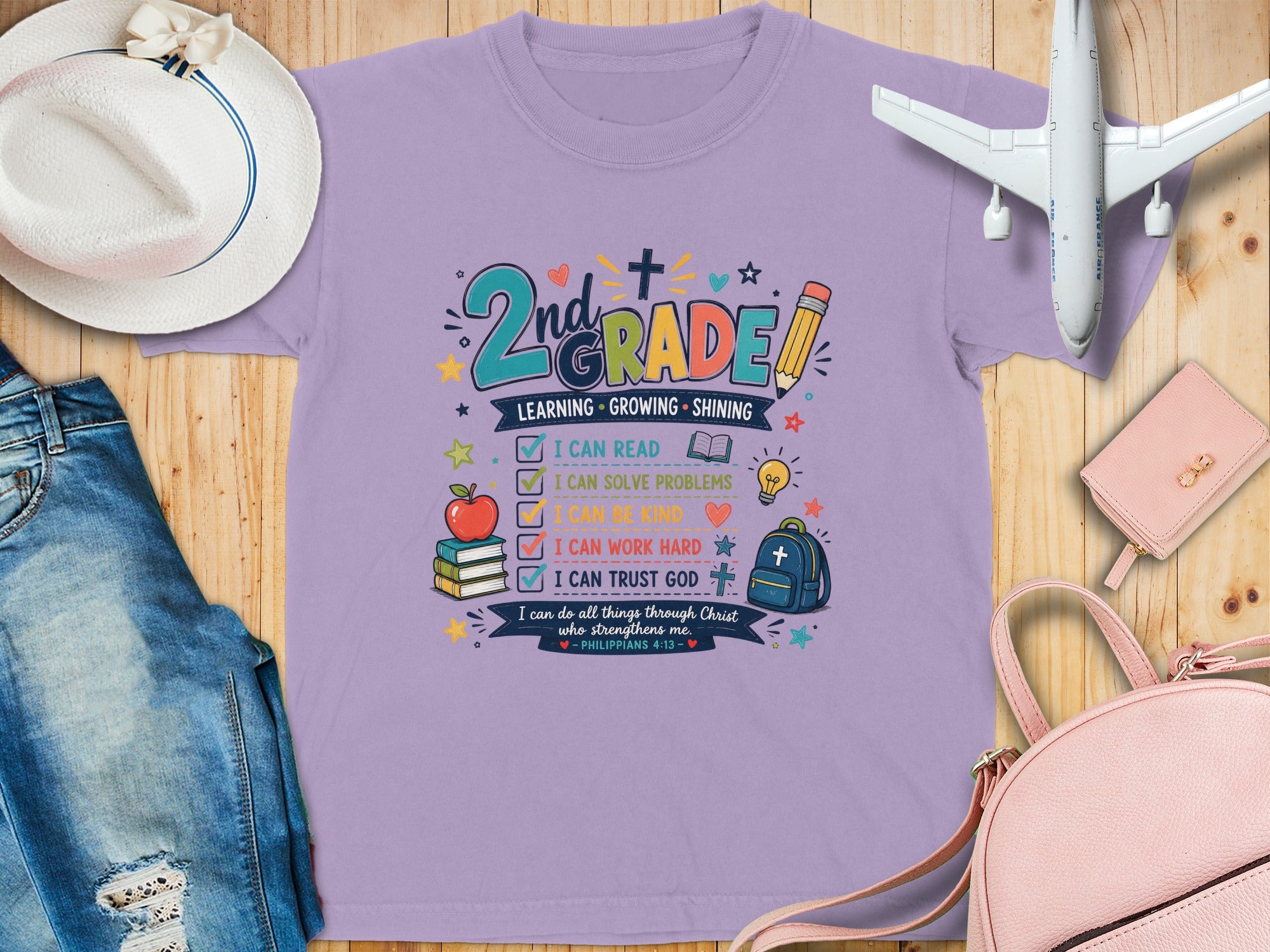 Light purple t-shirt with "2nd GRADE" text and inspirational phrases.