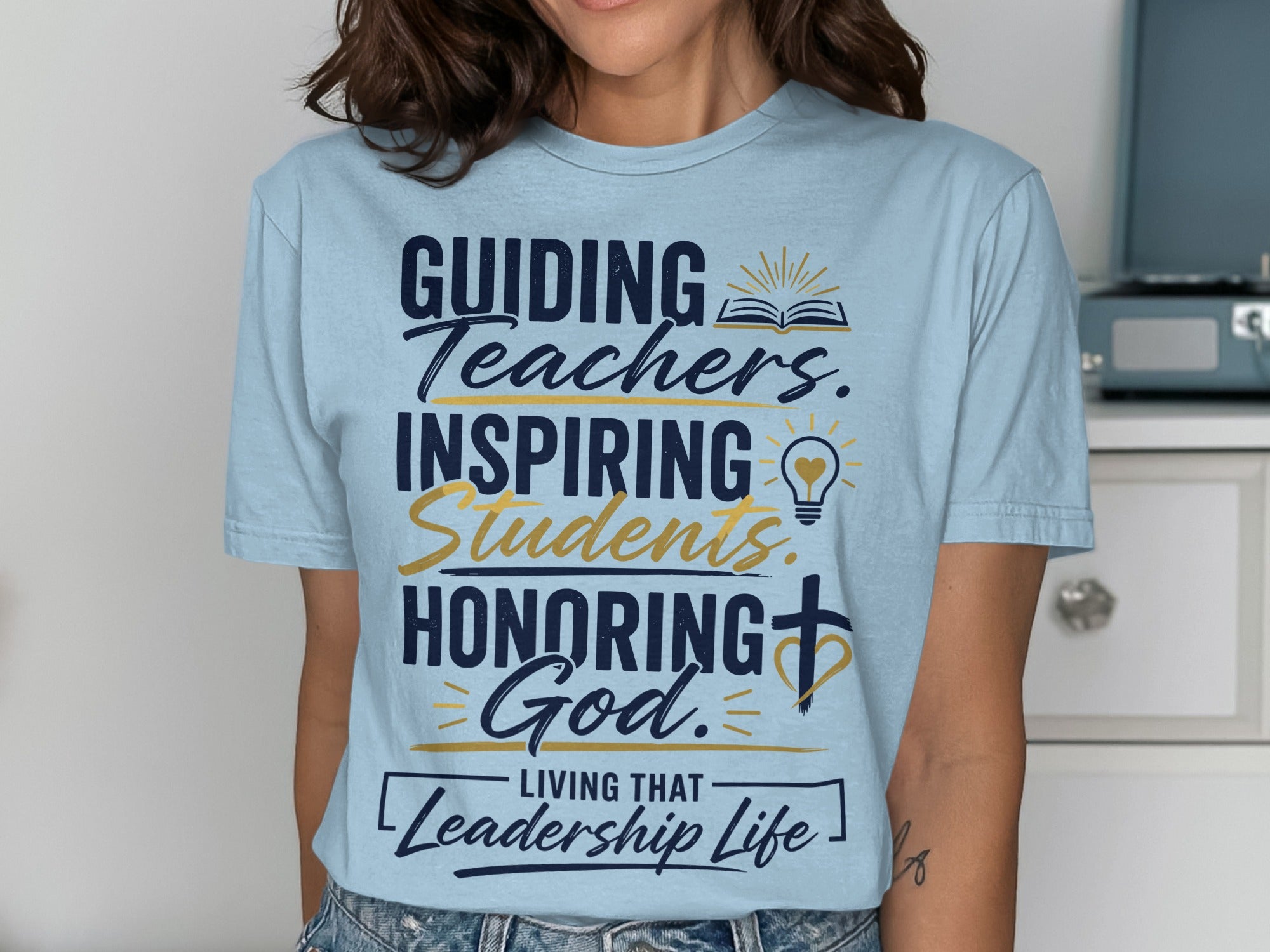 T-shirt with text: GUIDING Teachers. INSPIRING Students. HONORING God. LIVING THAT Leadership Life.