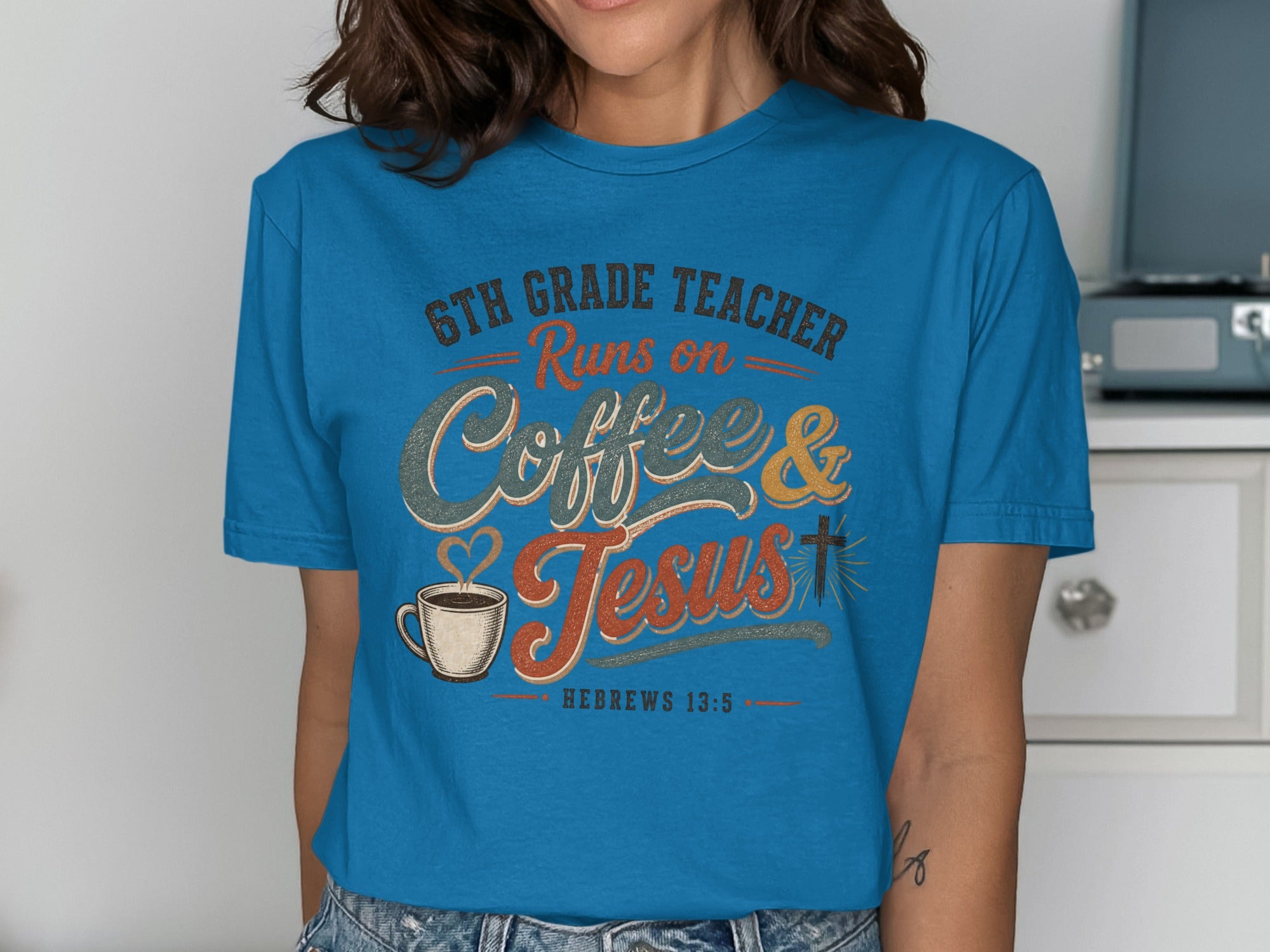 Blue t-shirt with "6th Grade Teacher Runs on Coffee & Jesus" text and coffee cup graphic.