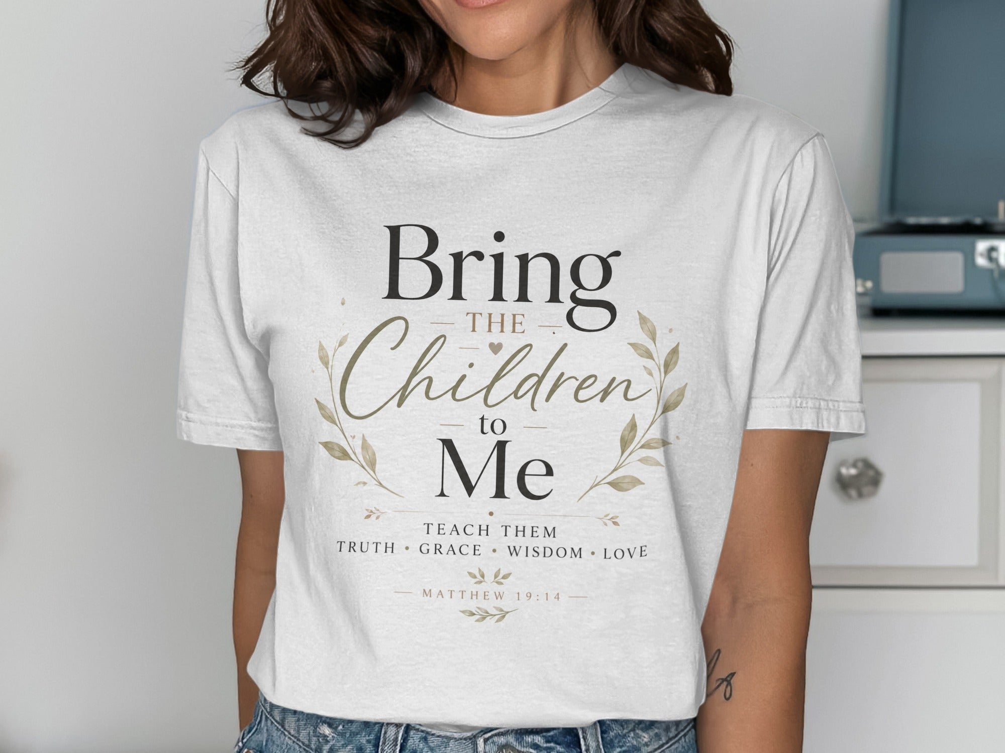 White t-shirt with "Bring the Children to Me" text and Matthew 19:14 reference.