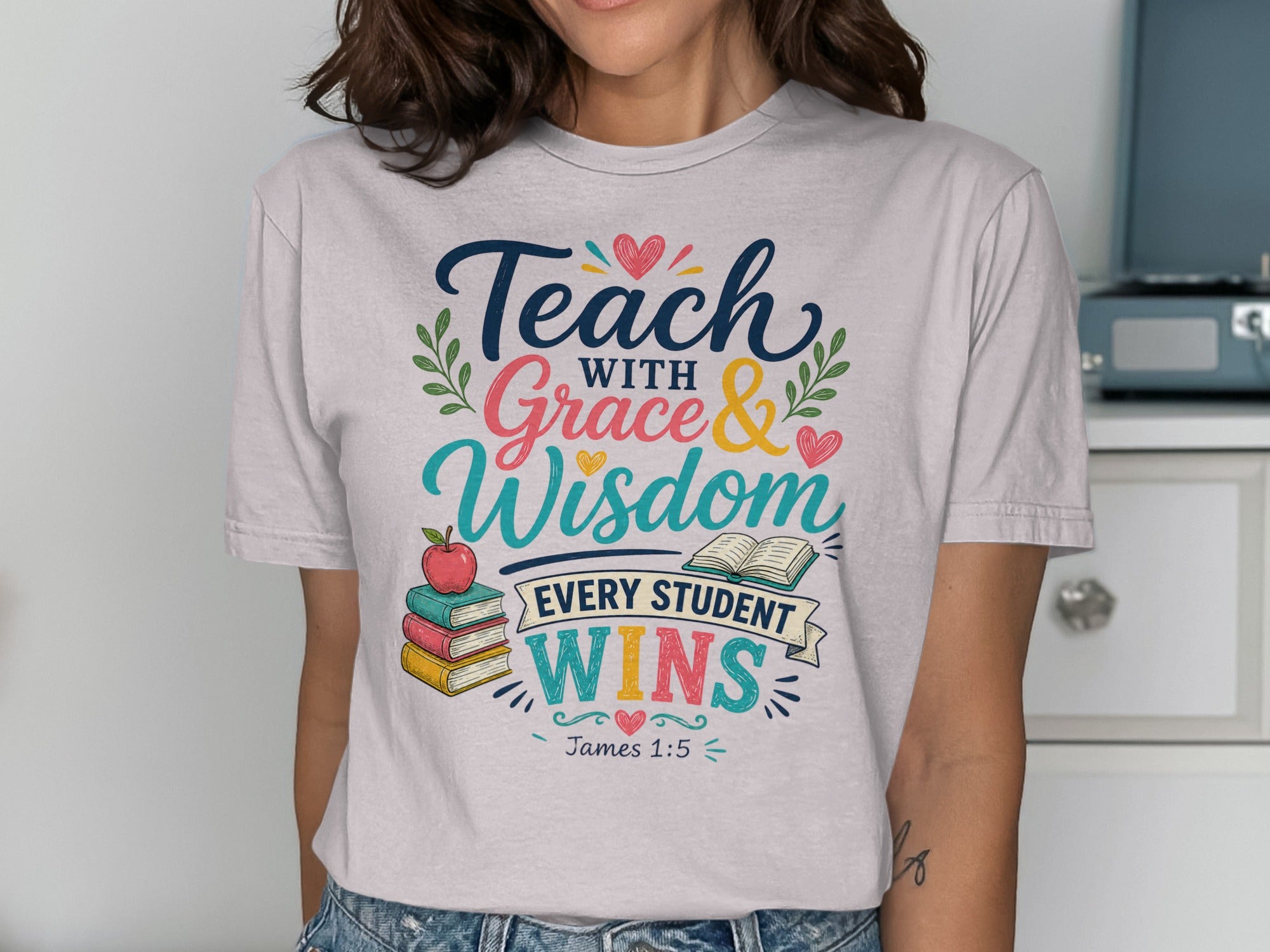 T-shirt with "Teach with Grace & Wisdom Every Student Wins" text and illustrations.