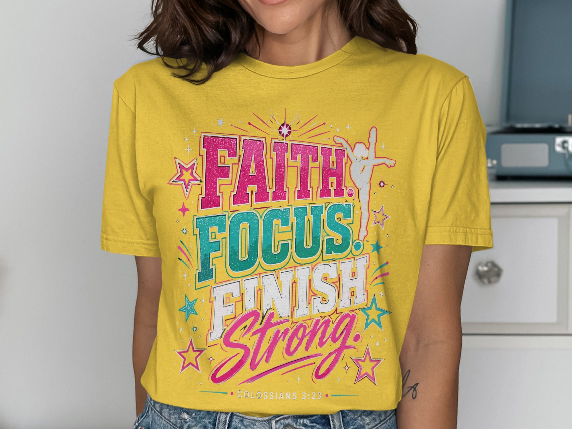 Yellow t-shirt with "FAITH FOCUS FINISH STRONG" and "COLOSSIANS 3:23" text.
