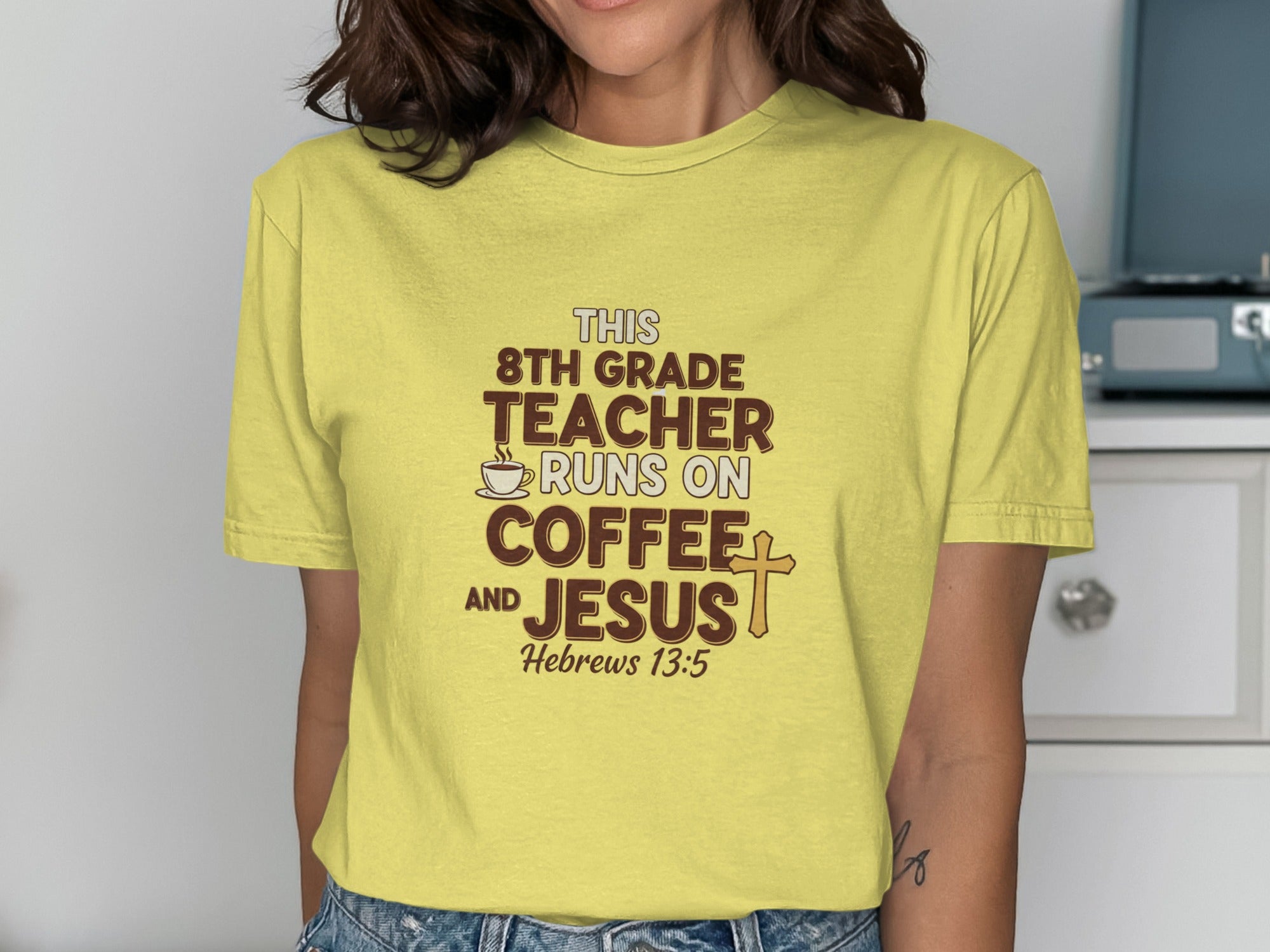 Yellow t-shirt with text "THIS 8TH GRADE TEACHER RUNS ON COFFEE AND JESUS".