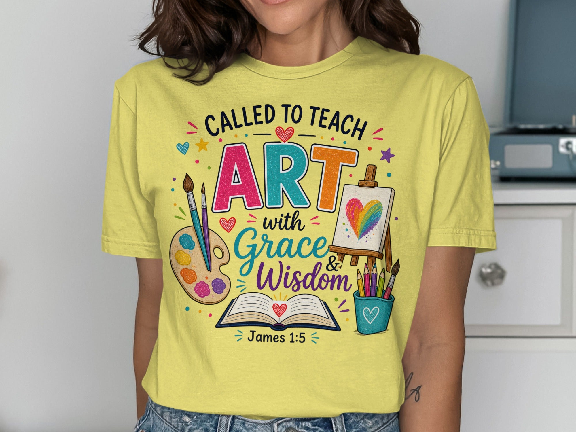 T-shirt with "Called to Teach Art with Grace & Wisdom" and James 1:5.