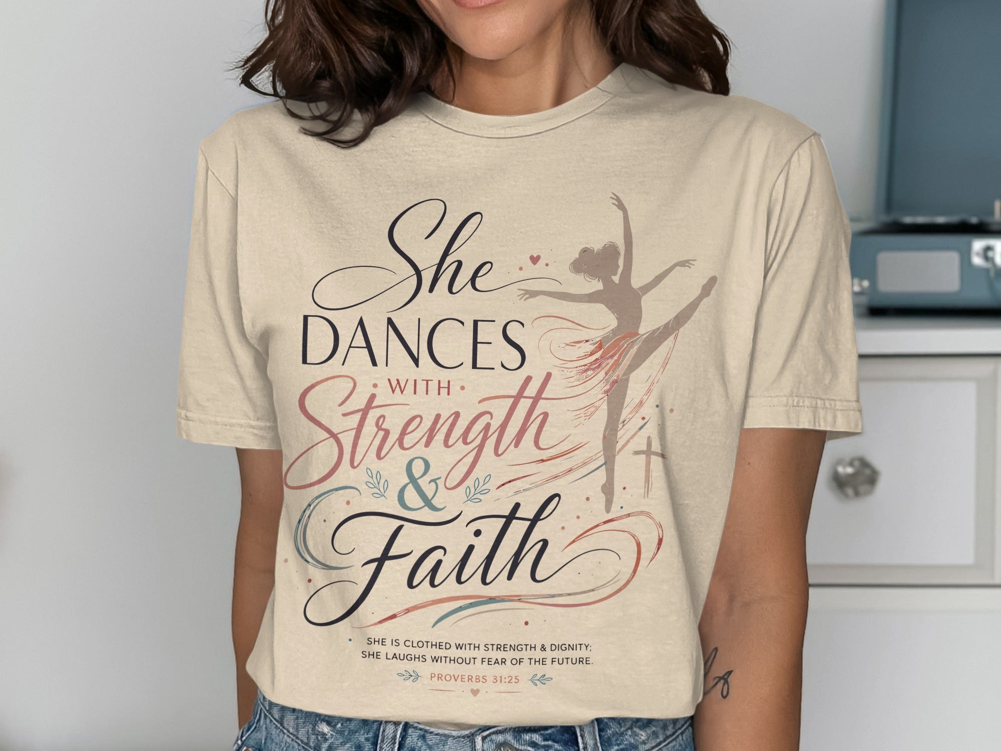 T-shirt with dancer graphic and Proverbs 31:25 text about strength and faith.