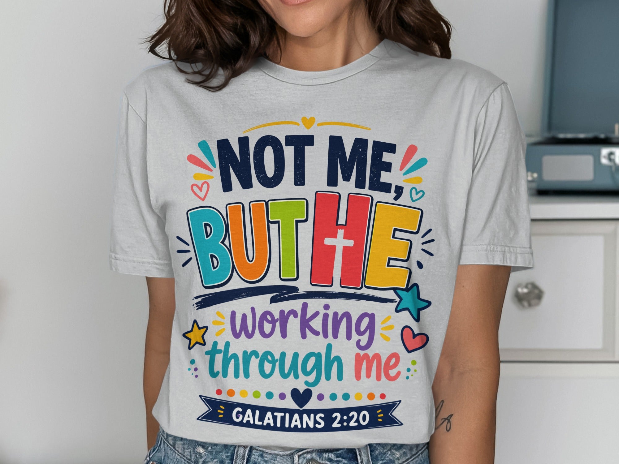 Grey t-shirt with "Not Me, But He" and "working through me" text, Galatians 2:20.