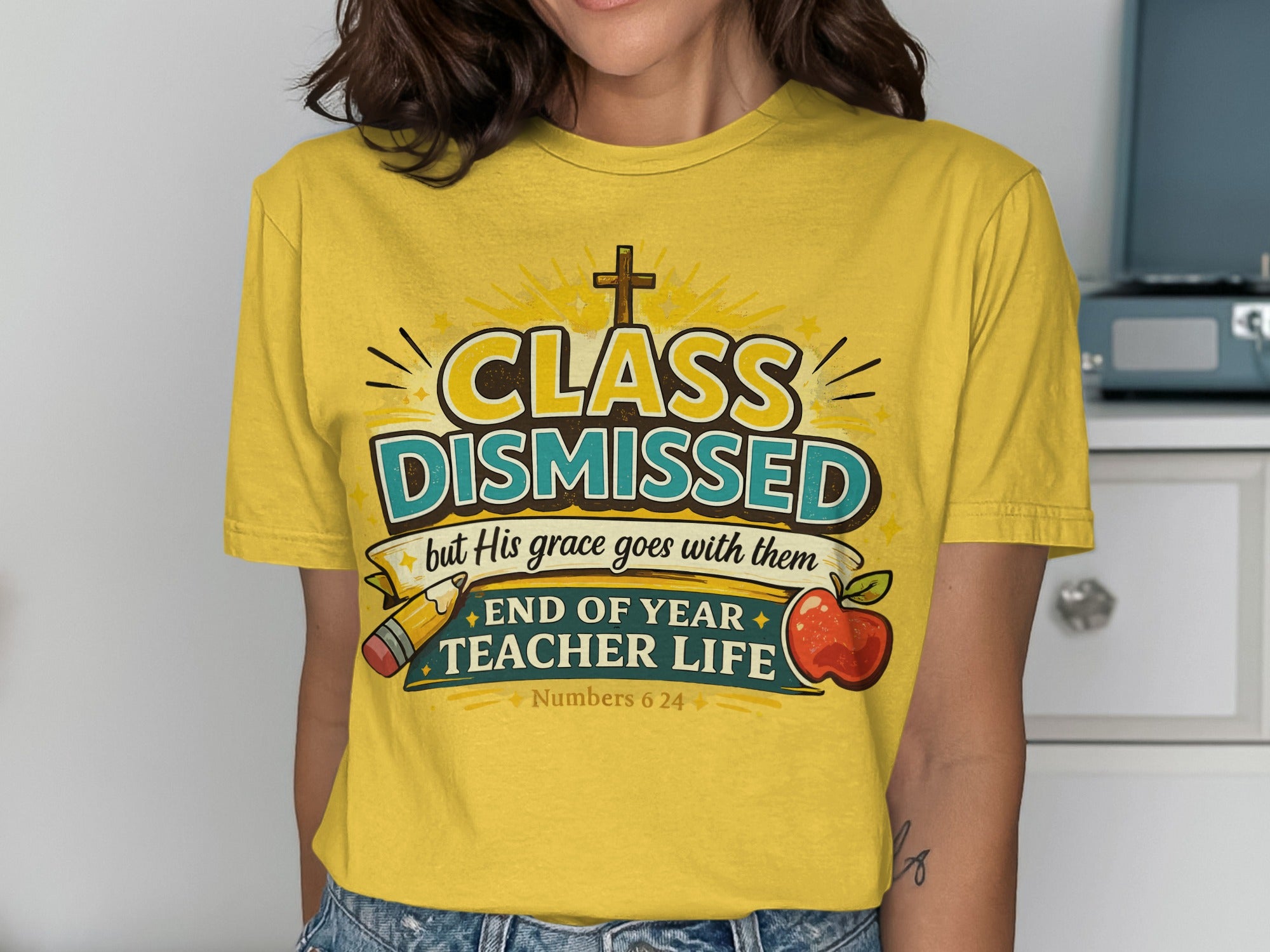 Yellow t-shirt with "Class Dismissed" and "Teacher Life" text, apple, and pencil.