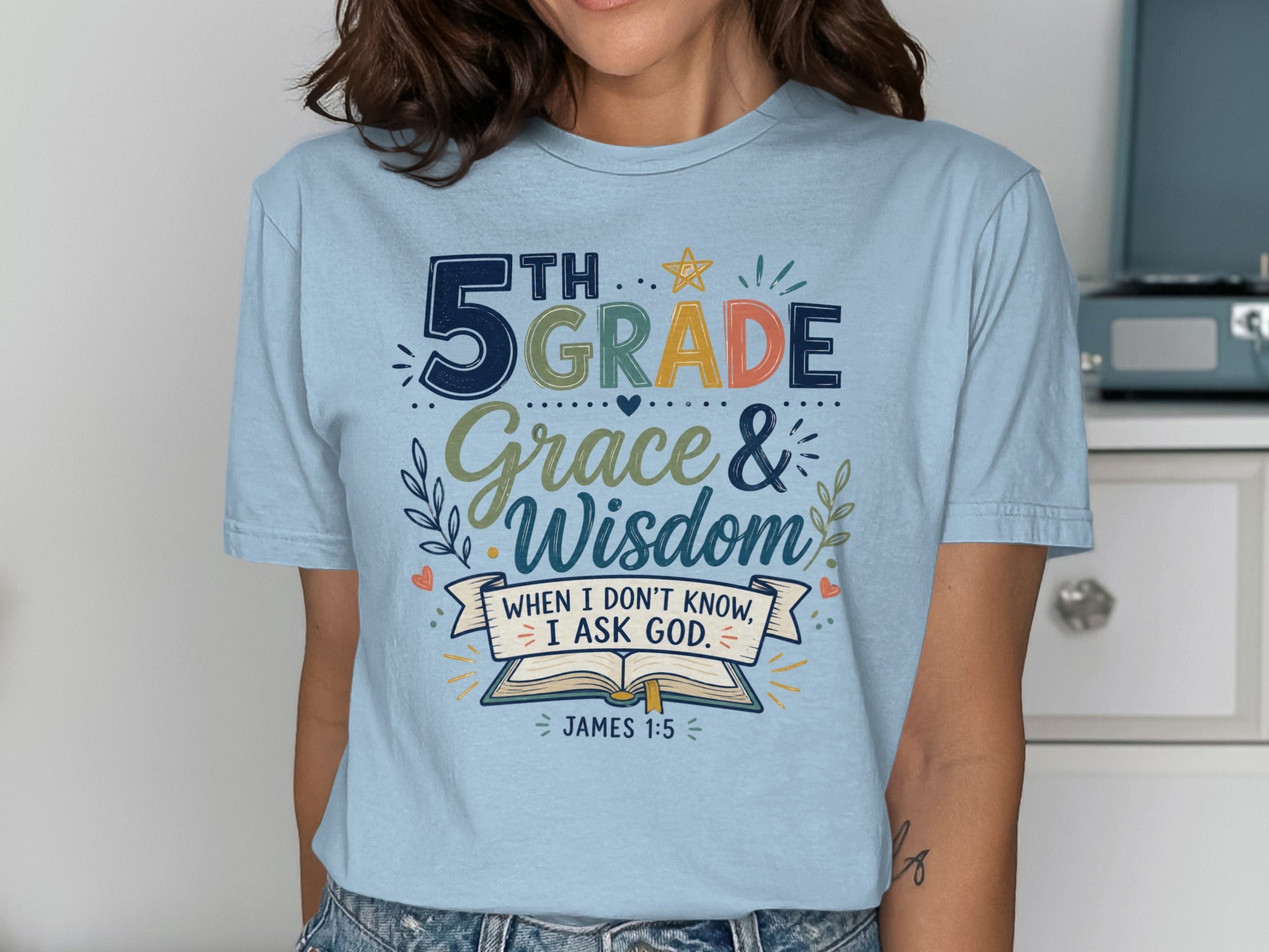 Light blue t-shirt with "5th Grade Grace & Wisdom" and Bible verse James 1:5.