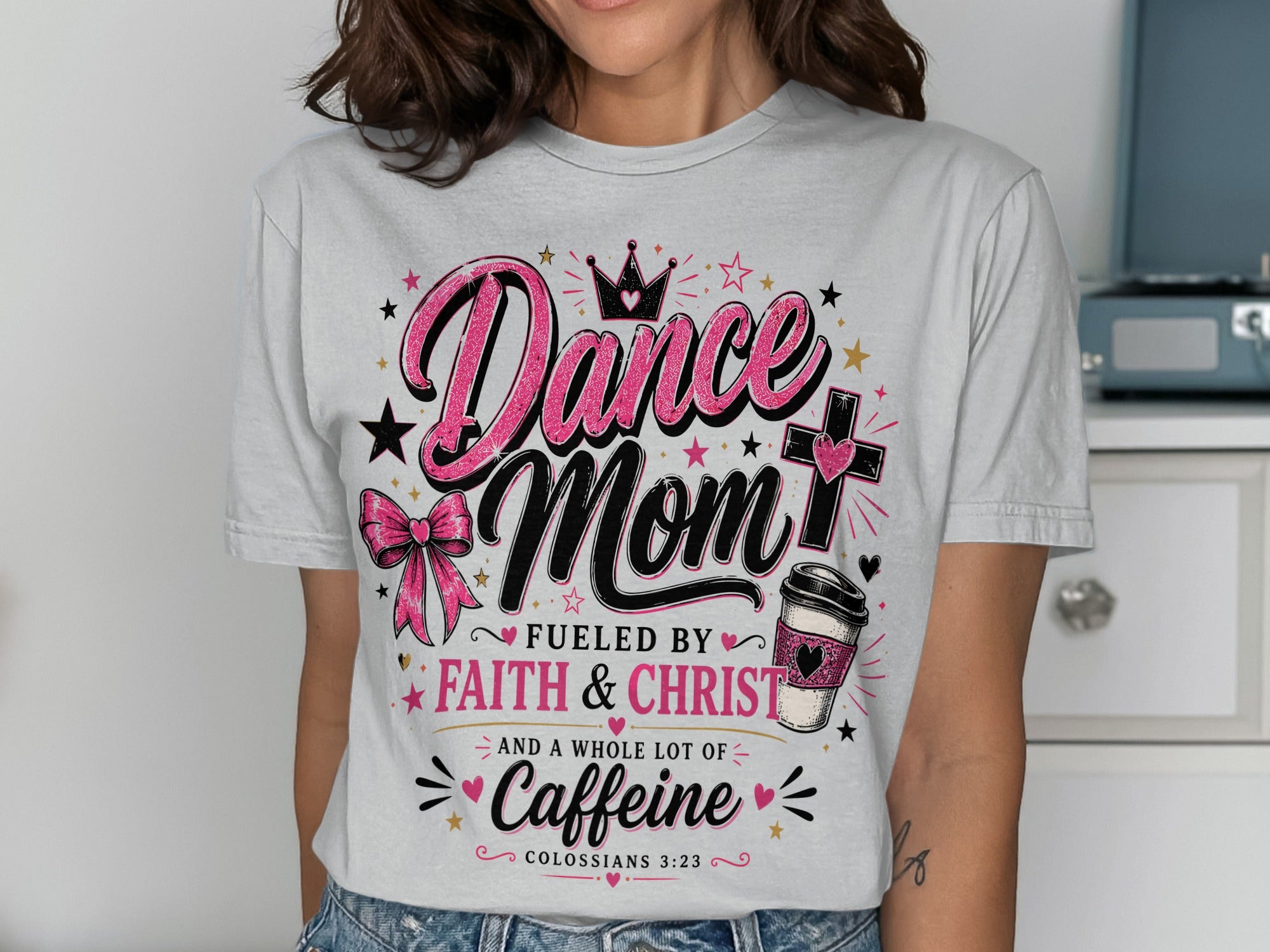 "Dance Mom Fueled by Faith, Christ, and Caffeine" t-shirt with coffee cup and bow graphic.