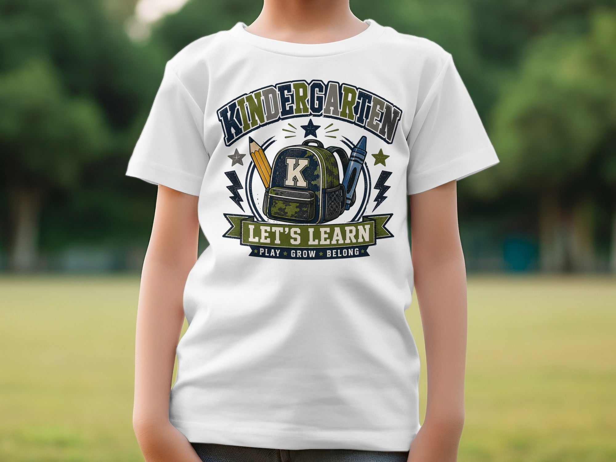 White t-shirt with "Kindergarten Let's Learn" and school supplies graphic.