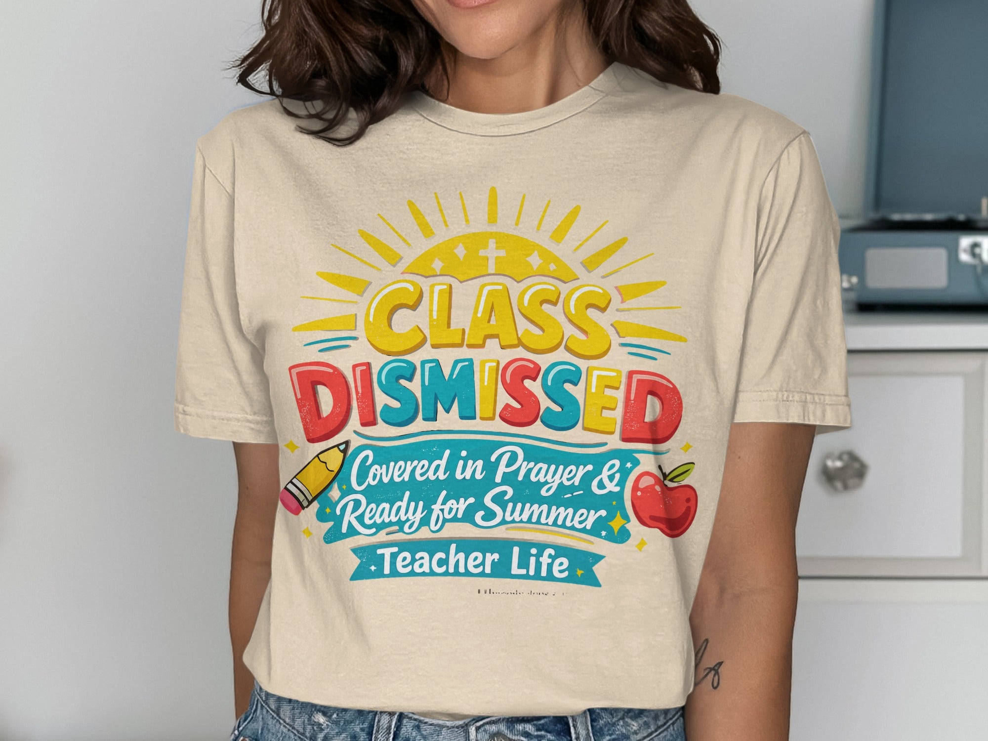 Class Dismissed, Ready for Summer, Teacher Life text on a tan t-shirt.