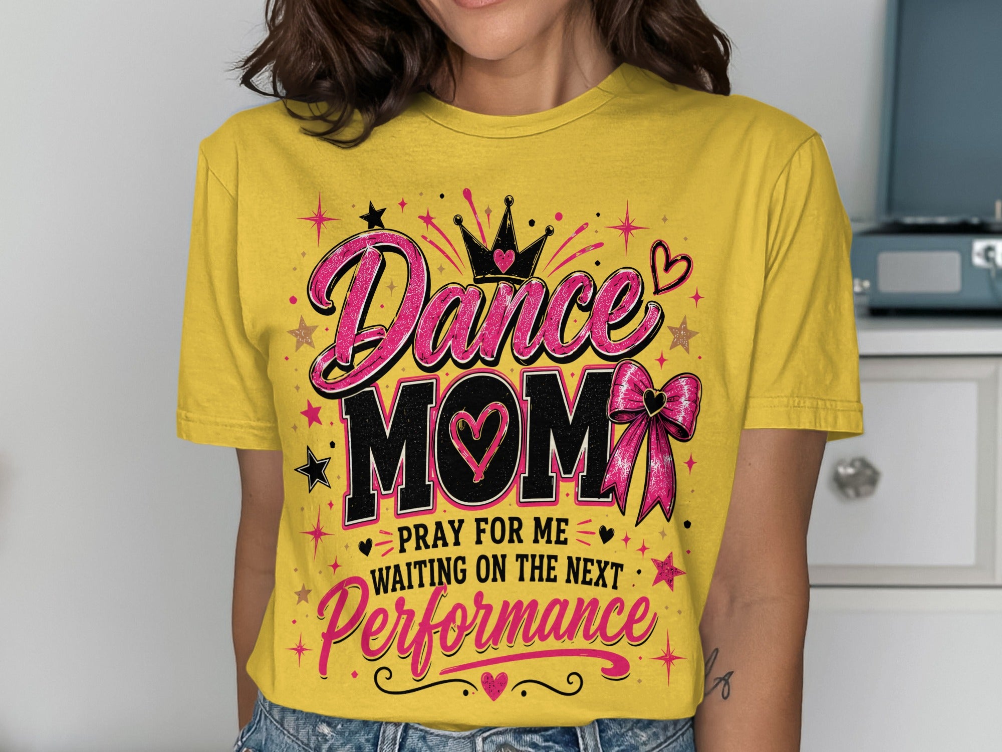 Yellow t-shirt with "Dance Mom" text, crown, heart, and bow.