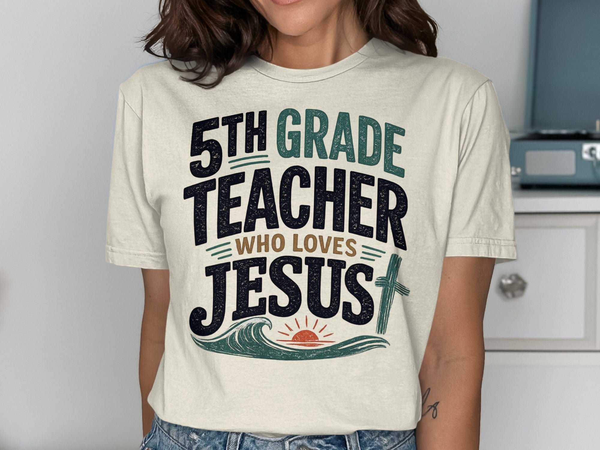 5th Grade Teacher Who Loves Jesus text with wave and sun graphic.