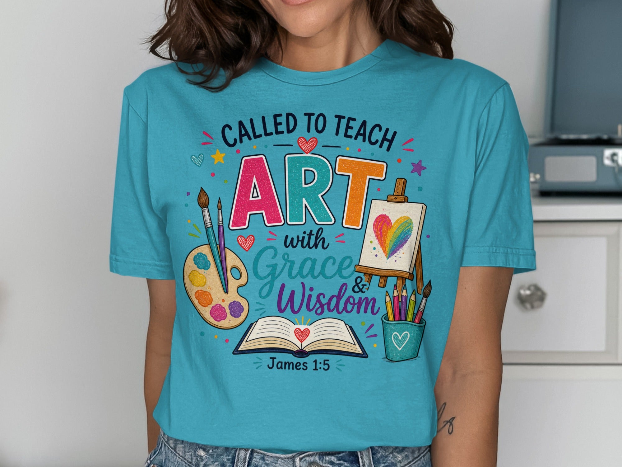 T-shirt with "Called to Teach Art with Grace and Wisdom" and Bible verse James 1:5.
