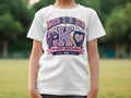 White t-shirt with "Kindergarten" graphic and school supplies.