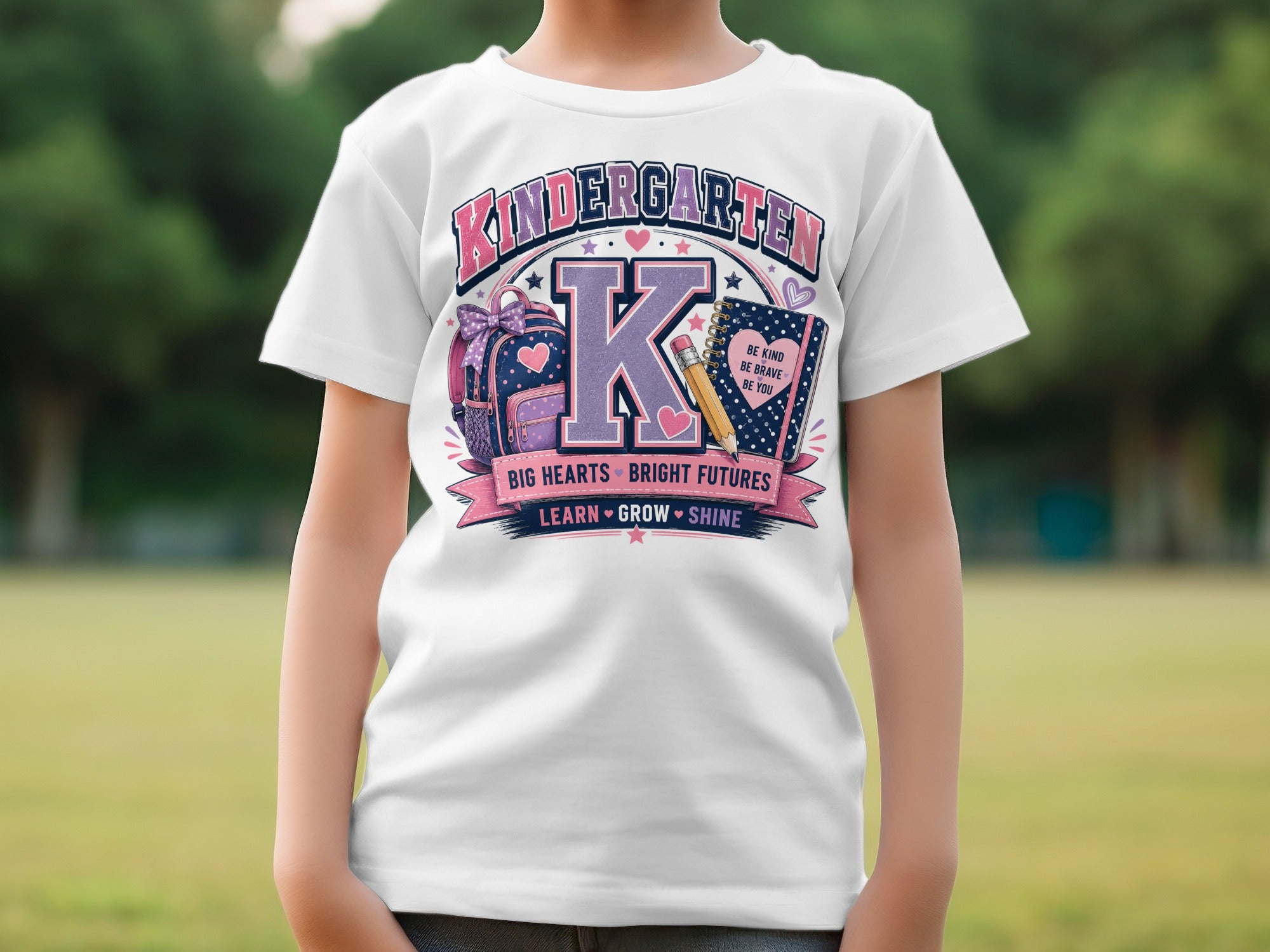 White t-shirt with "Kindergarten" graphic and school supplies.