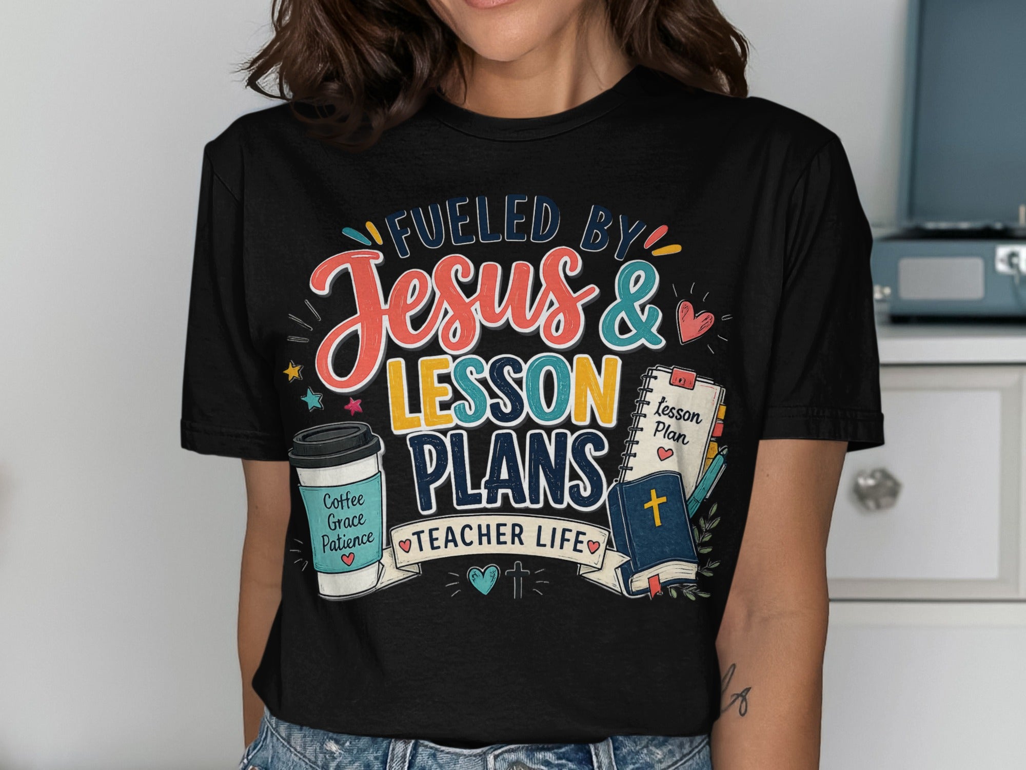 T-shirt reads "Fueled by Jesus & Lesson Plans Teacher Life".