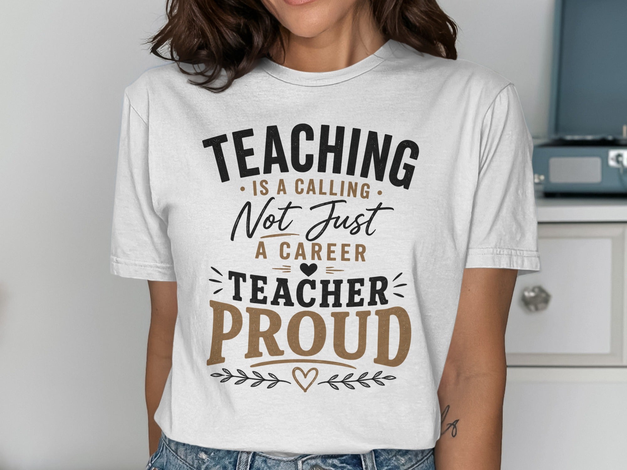 White t-shirt with "Teaching is a calling, not just a career. Teacher proud." text.