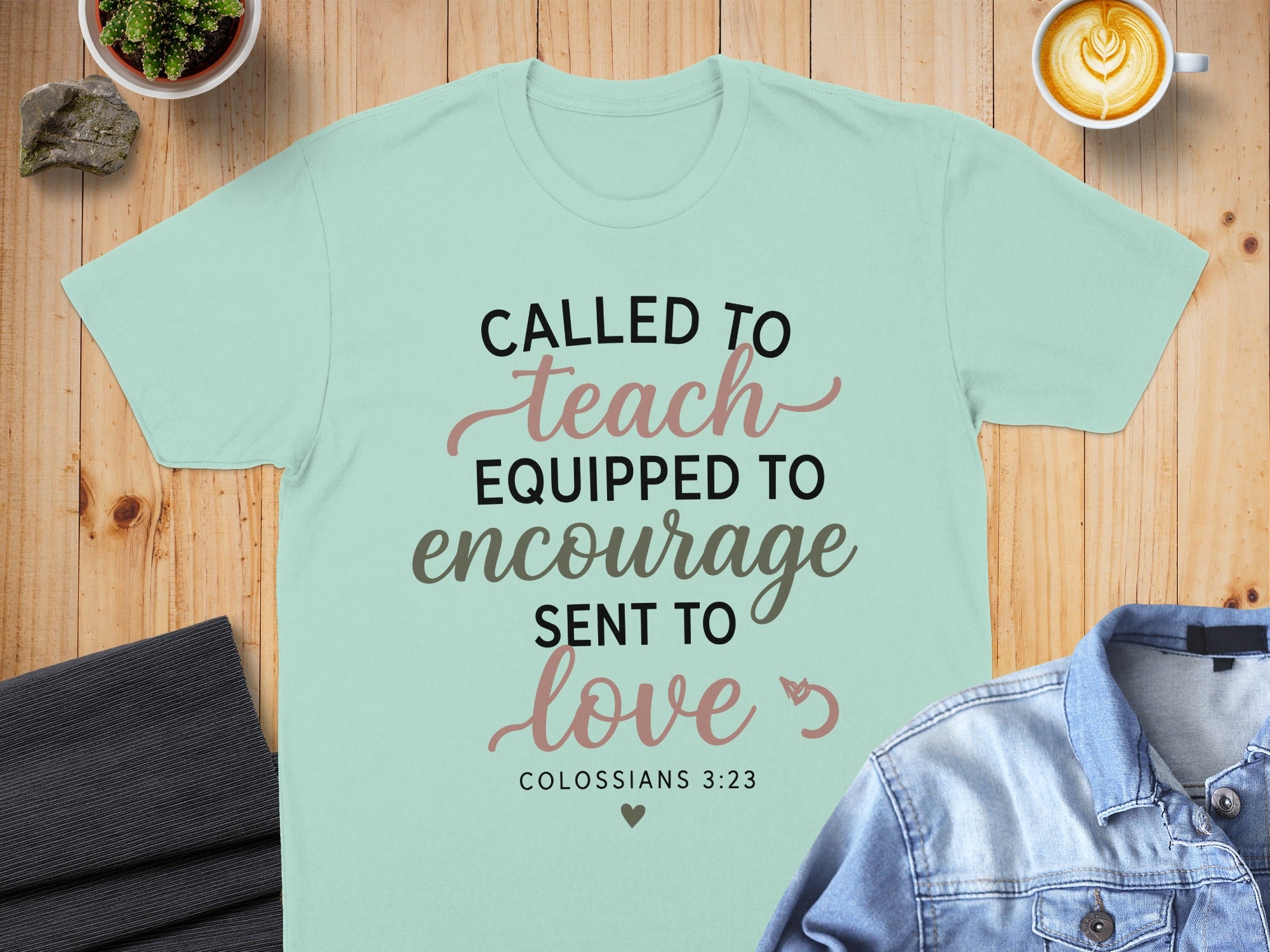 T-shirt with "Called to Teach, Equipped to Encourage, Sent to Love" and "Colossians 3:23".