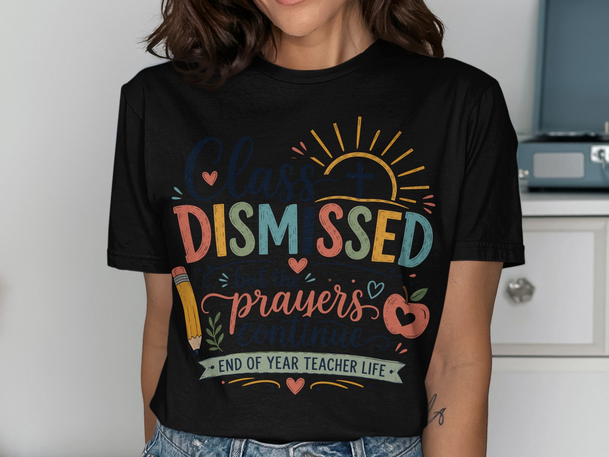 Black t-shirt with "Class Dismissed, but the prayers continue" text and sun.
