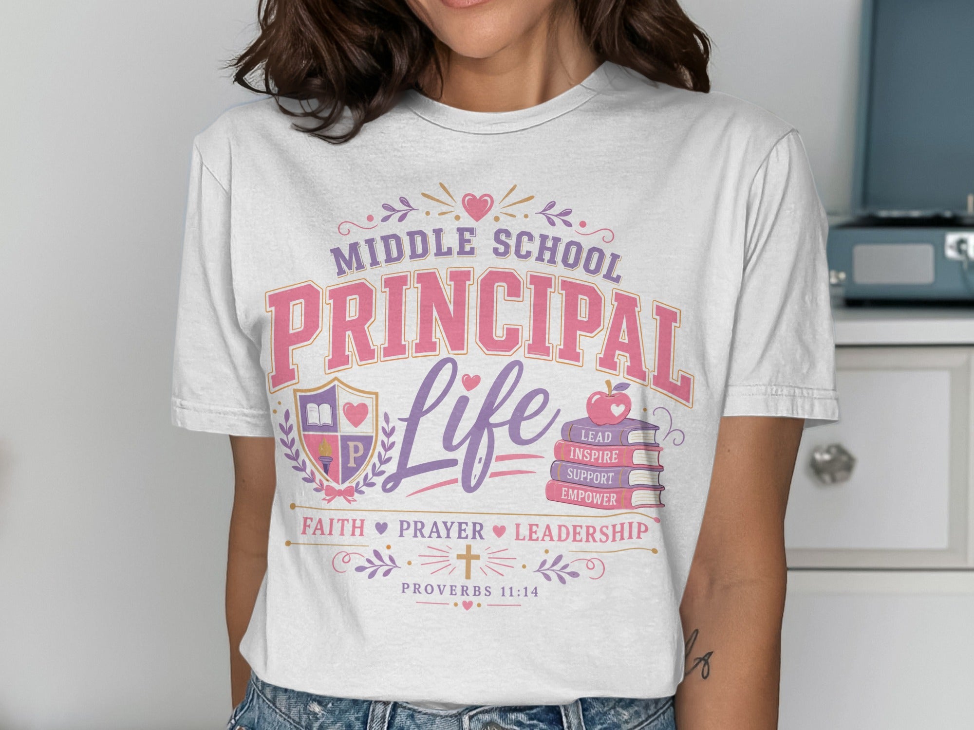 White t-shirt with "Middle School Principal Life" text, icons, and Proverbs 11:14.