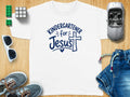 White t-shirt with "Kindergartener for Jesus" graphic and a cross.