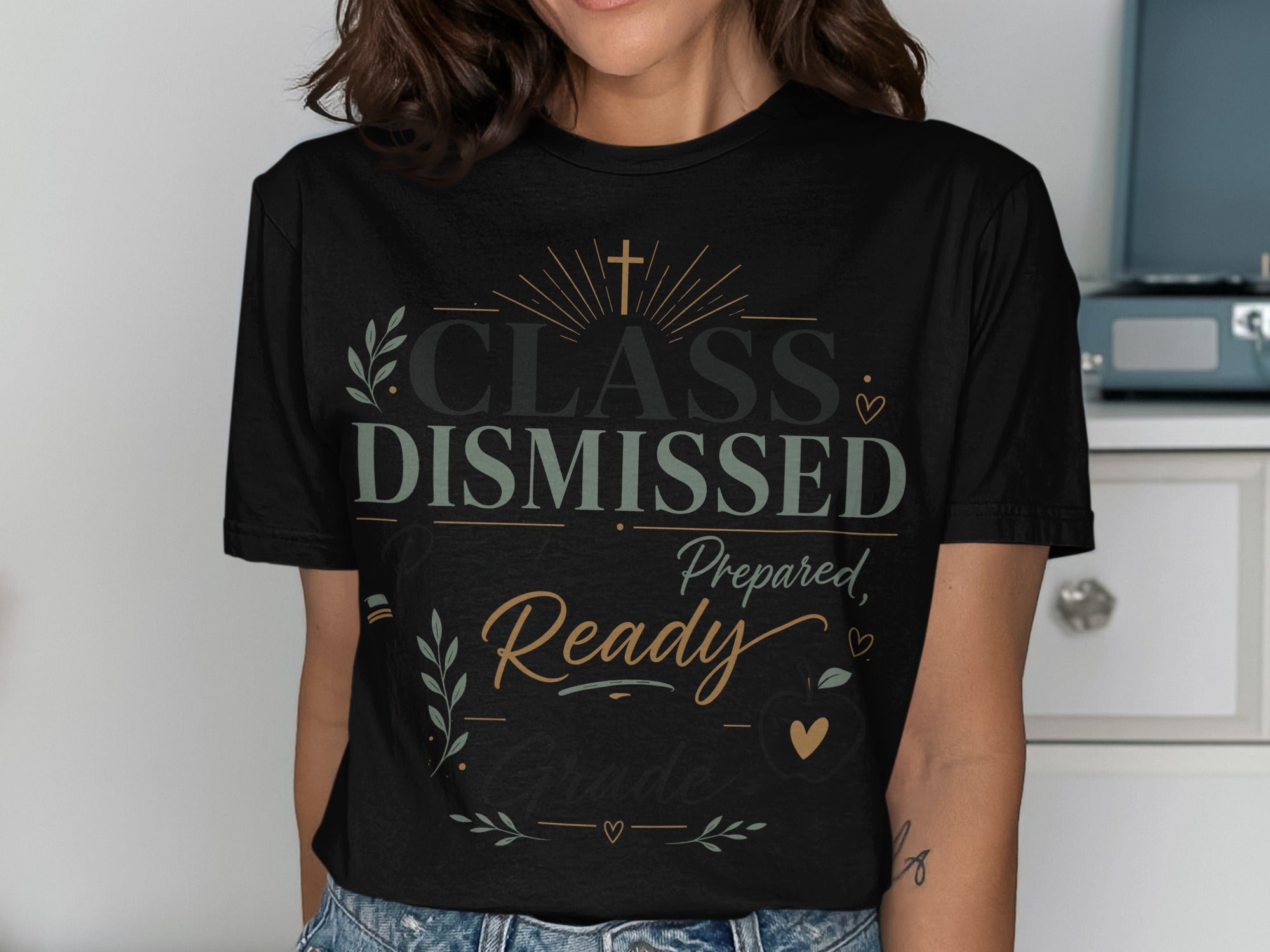 Black t-shirt with "CLASS DISMISSED Prepared, Ready for Grade" text and decorative elements.
