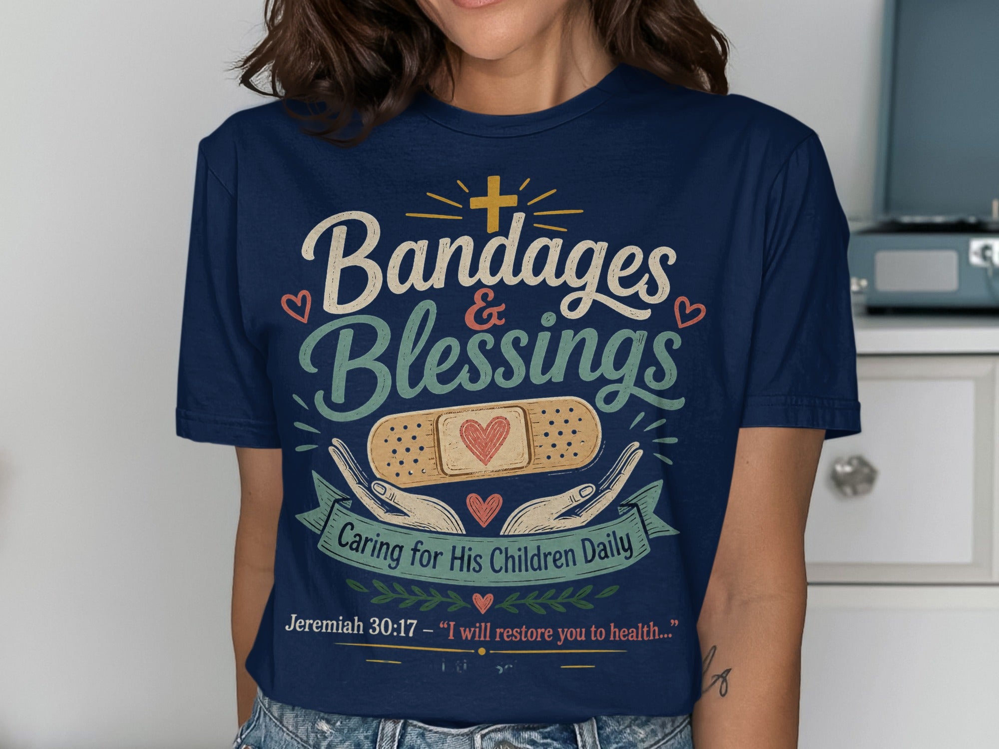 Navy t-shirt with "Bandages & Blessings" and Jeremiah 30:17 Bible verse.