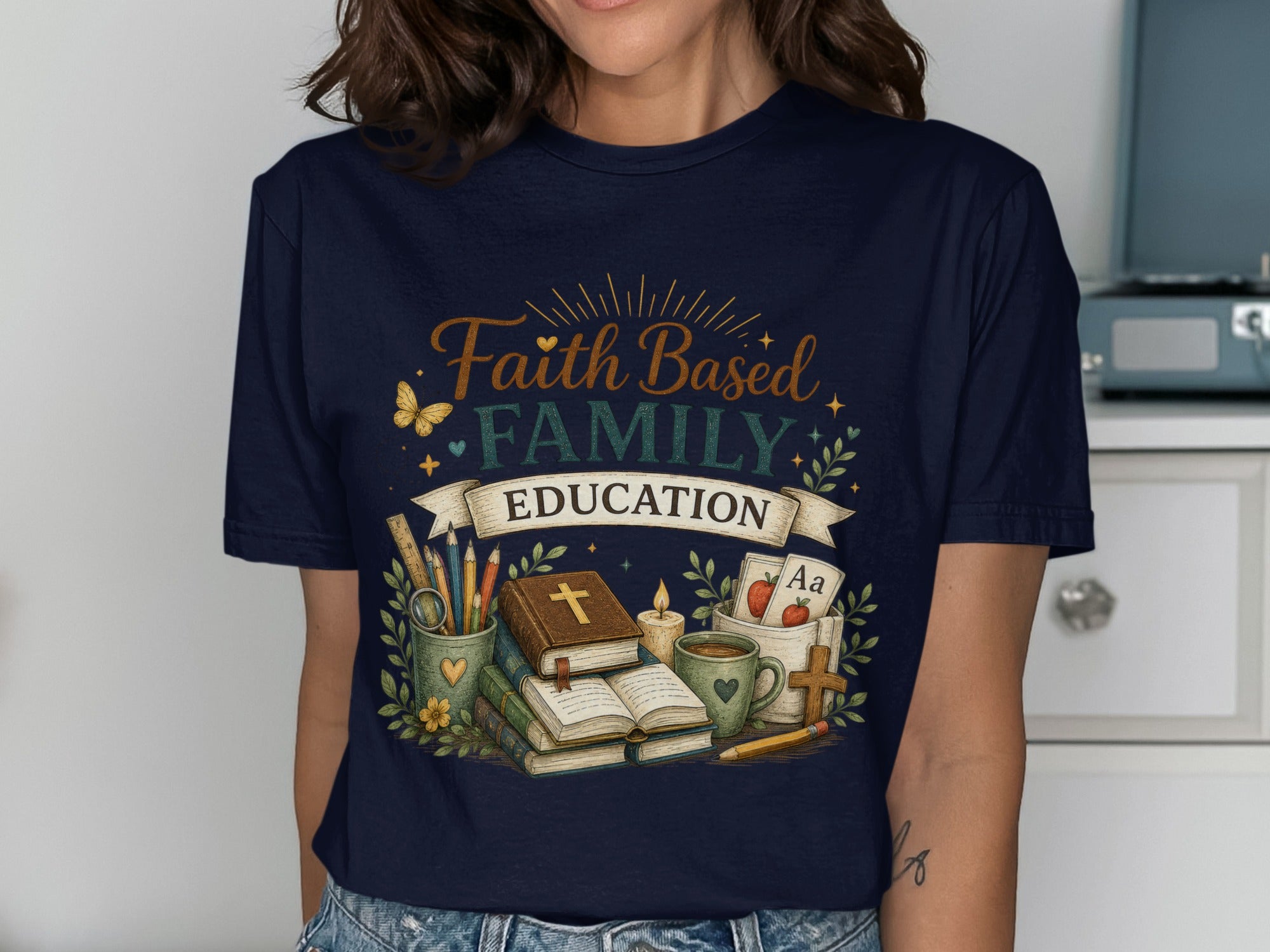 T-shirt with "Faith Family Education" text, books, and school supplies.