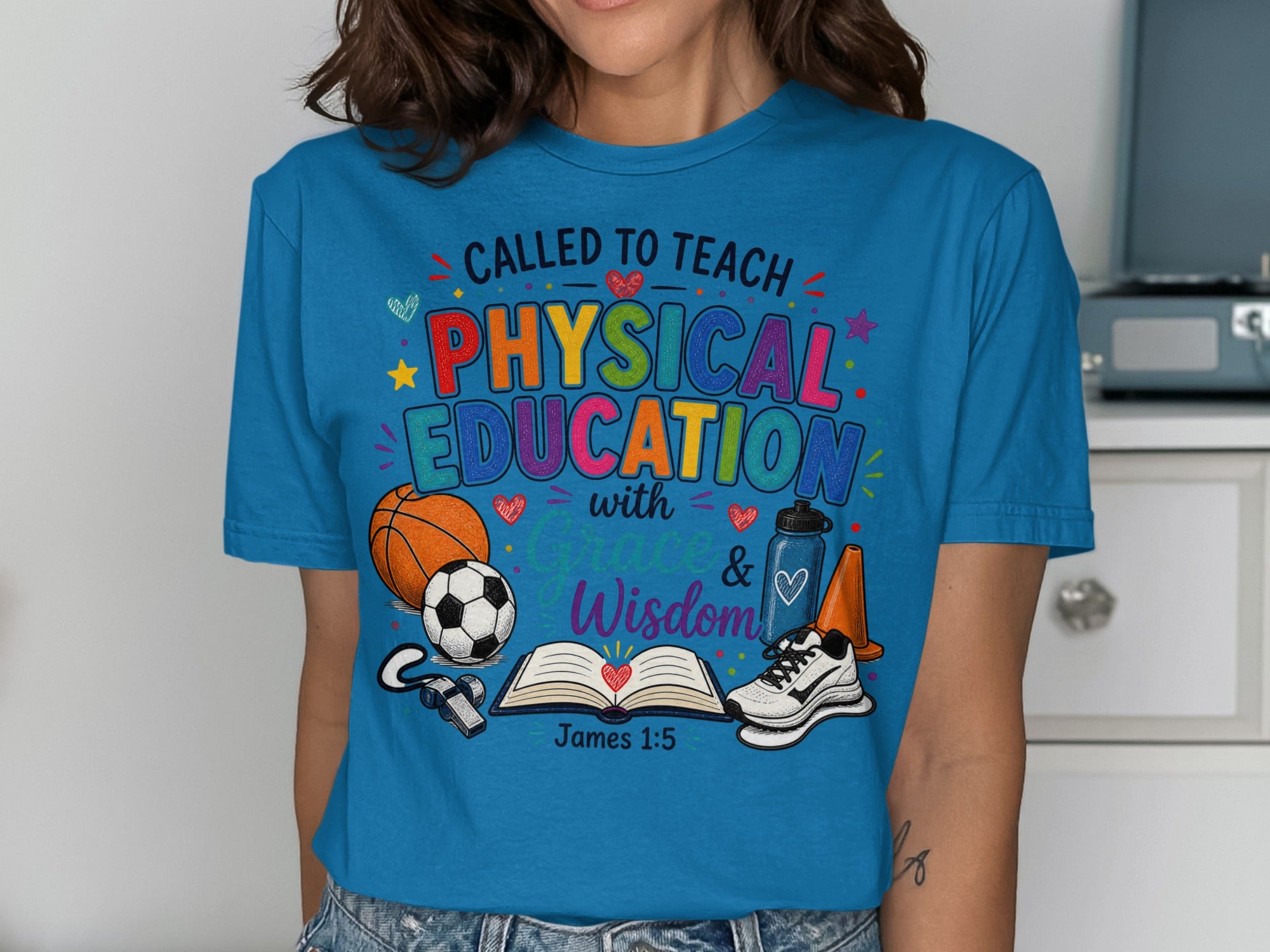 Blue t-shirt with "Called to Teach Physical Education with Grace & Wisdom" text.