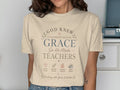 Cream t-shirt with "God Knew Classrooms Needed Grace So He Made Teachers" text.